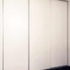 Three-white-melamine-sliding-door-with-triple-tracks