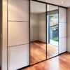 Three divisions white acrylic and mirror sliding door